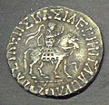 Coin of Azes II, with a clear depiction of his military outfit, with coat of mail and reflex bow in the saddle.