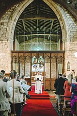 Sanctuary and rood screen with congregation