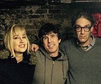 The Muffs smiling for a group picture