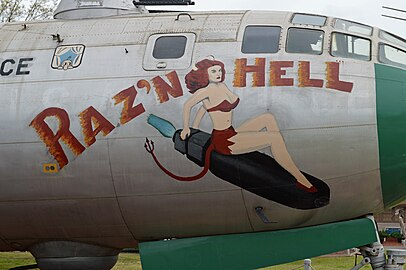 Nose art on B-29A Superfortress "Raz'n Hell", Kilroy is seen in the top left corner.