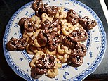 Swedish home-baked sweet pretzels known as kringlor, some with chocolate