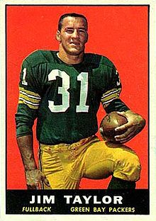 A playing card showing Jim Taylor kneeling in his uniform holding a football