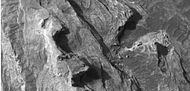 Close up of top of light toned butte, as seen by HiRISE under HiWish program.