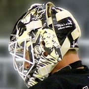 Brent Johnson's mask featuring Led Zeppelin graphics and lyrics