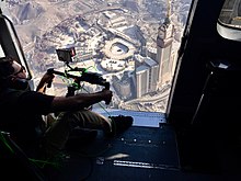 Director, Abrar Hussain, filming the documentary One Day in the Haram from a helicopter. Masjid al-Haram in full view.