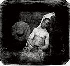 Hippolyte Bayard poses as a drowned man. He lies with his eyes closed, both for the technical reason of the long exposure required by his method and as a protest for the rejection of his claim as inventor of photography.