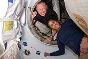 Suni and Butch pictured in the vestibule that connects the ISS to Starliner
