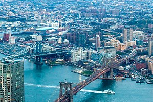View of Dumbo from One World Trade Center in 2016, framed by the Brooklyn Bridge (bottom right) and Manhattan Bridge (center left)