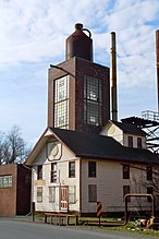 Bomberger's Distillery, with a whiskey jug on top
