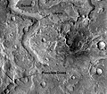 Huo Hsing Vallis in Syrtis Major quadrangle. Straight ridges may be dikes in which liquid rock once flowed.