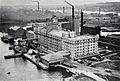 Spiller's Millennium Mills in 1934. Behind is the Graving Dock