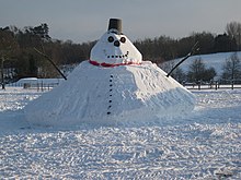Photograph of a giant snowman with a conical base in South Nutfield, Surrey, England