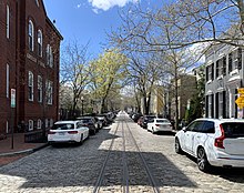 View of P Street NW in Georgetown, which features streetcar tracks installed by the Metropolitan Railroad in the 1890s