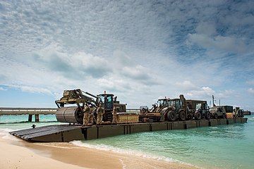 Mexifloat unloading on the beach at Grand Tuck with heavy plant for use in the rebuild after the hurricane