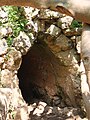 Entrance to tunnel whence flowed a natural spring, now run-dry