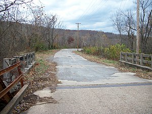 Old Highway 71 looking west from the truss bridge over the west fork of the White River (Greenland segment)