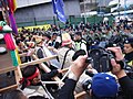 Korean protesters confronted with Hong Kong police in the defense line in Hung Hing Road in Wanchai.