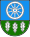 A coat of arms depicting a white wheel on a light blue background at the top and three white leaves on a green background at the bottom