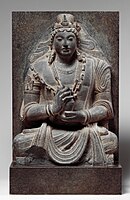 Seated Maitreya, 7th-8th century AD, near Kabul, Afghanistan. "Stylistically related to Shahi sculpture of northern Pakistan and Afghanistan".[124]
