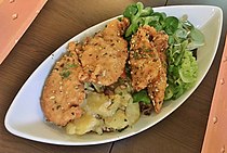 Styrian fried chicken salad with potato- and cornsalad
