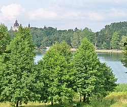 View of Wielewskie Lake with the Saint Nicholas Church in the background from the Wiele Calvary