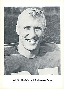 Black and white photo of Hawkins in a football uniform