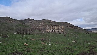 Ruined homes in the village