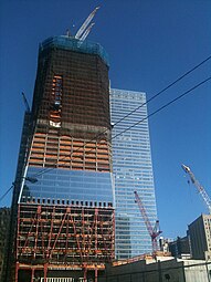 View from West Street as of February 5, 2011. 7 World Trade Center is visible in the background on the right. Steel tops the 56th floor.