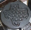 A waffle iron in the shape of Texas, commonly found at motels in the state