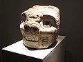 The tusks are present in all the arts of Chavín including in the sculpture as this nails head.