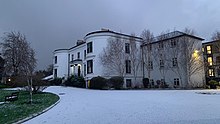 Photograph of Hillcourt House with snow on the drive