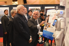 Ryuko Hira guiding Prime Minister of India - Narendra Modi at the JNTO Robot Pavilion during his State visit in October 2018