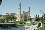 A decorated mosque with a park in front