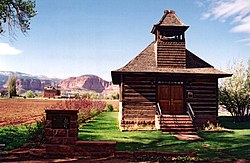 A Utah historic site, this old log schoolhouse with its bell tower and red sandstone steps is a reminder of Torrey's pioneer heritage.