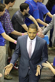 Jordan Mincy as an assistant coach with the Florida Gators after a Gators win