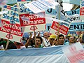 Image 46Union members march in Argentina on Human Rights Day in December 2005. The signs read "Worker rights are human rights..
