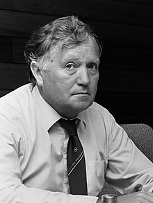 A black and white picture of a football chairman