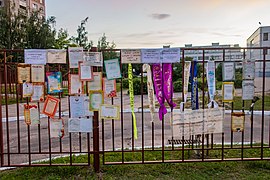 "Wall of shame" near a school with diplomas issued by the school, graduate sashes and protest inscriptions. Such installations were made in protest against presumable falsifications by the teachers[315]