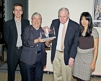 Ashbery accepts the "BoBi" Award. From left to right: Johnny Temple, Marty Markowitz, Ashbery, and Tina Chang.