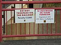 No trespassing signs with penalty, in English and Latin