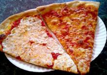 Slices of traditional New York–style pizza on right, with fresh instead of dried mozzarella cheese on left