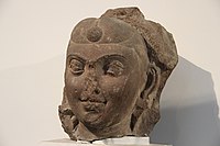 An example of hairstyle with frontal bun, under the Kushans