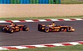 Heinz-Harald Frentzen and Enrique Bernoldi in the Orange liveried Arrows A23s at the 2002 French Grand Prix.
