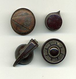 various knobs, three of which incorporate pointers to indicate setting