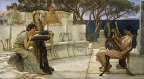 A man plays the lyre in front of an audience of five women, in a Greek-style theatre. The names of women associated with Sappho are inscribed on the seats.
