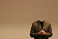 Jimmy Wales speaking at FOSDEM 2005, sans head. By Eedo Bee