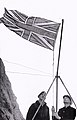 A party from HMS Vidal hoist the Union Flag over Rockall in 1955