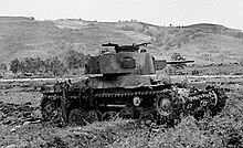 tank in profile facing right with hills in background