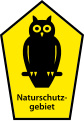 Owl on pentagonal sign