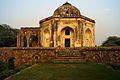 https://gowithharry.com/mehrauli-archaeological-park-heritage-walk/%7CQuli Khan's Tomb is located near Boat House